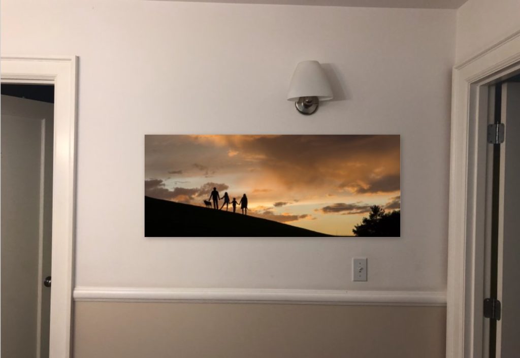 Panoramic Metal print of family at sunset on hill