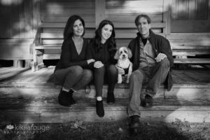 Family of three with teen girl and havanese dog on porch