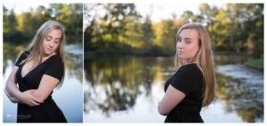 Blonde girl in black dress by lake with reflections of trees