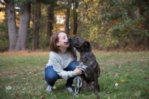 Brindle rescue dog kissing his mom