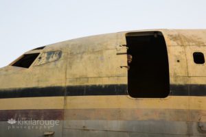 Young boy playing in an abandoned plane Uganda