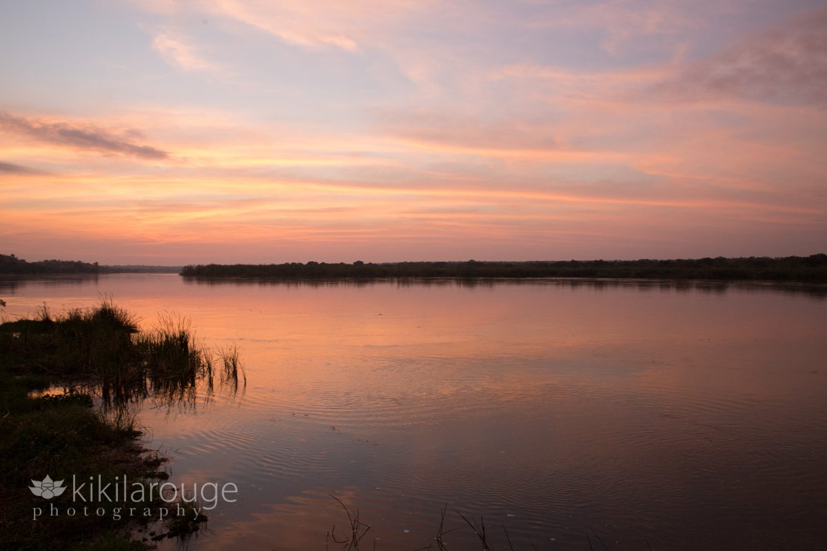Pink sunrise on the Nile River in Uganda