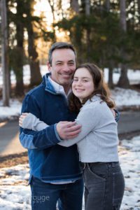 Dad with his teen daughter hugging