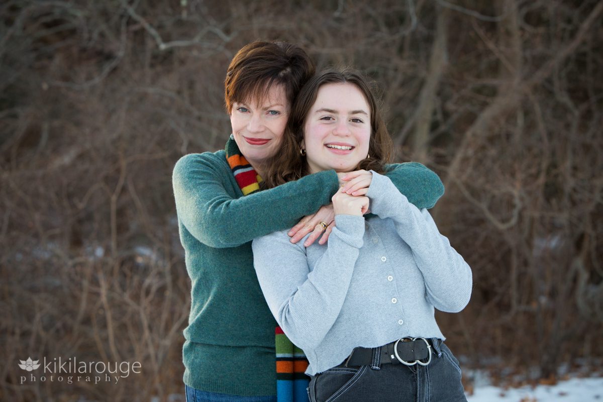 Mom hugging her teen girl