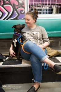 Rescue pup looking up at her foster Mom