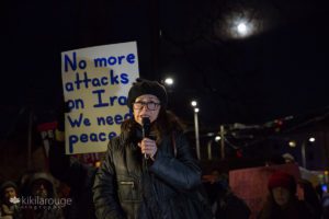 Professor from Iran at antiwar protest speaking to crowd