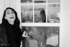 Women laughing with her Nana through a window