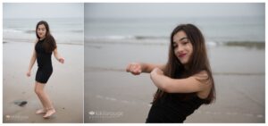Teen girl dancing on misty beach with black dress