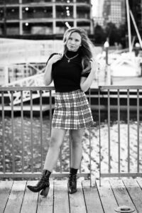 Girl in Boston Harbor area with black boots plaid skirt Senior portrait