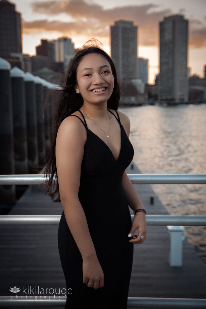 Sunset portrait of girl in black prom dress Boston