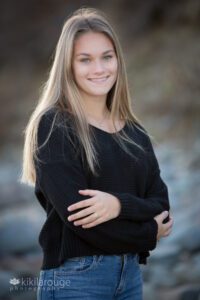 Senior Portrait Blonde girl in black top and jeans at beach fall