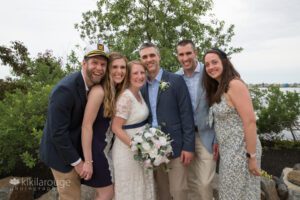 Wedding couple with family smiling and laughing
