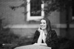 BW portrait girl on concrete wall with brick background
