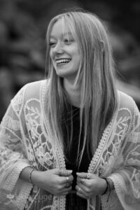 Girl laughing holding white lace long top