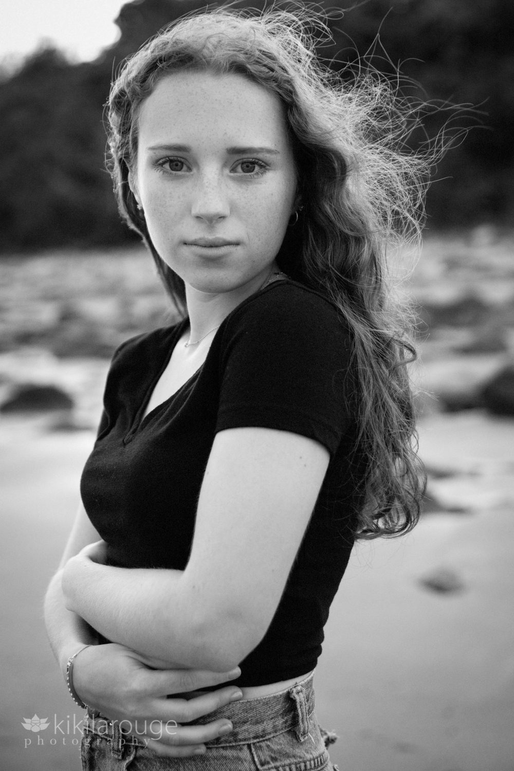 Portrait teen girl black top looking straight into camera