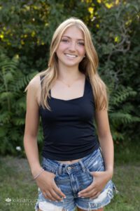 Blonde teen in jean shorts Senior portrait