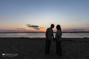 Couple in silhouette at sunset Plum Island Beach