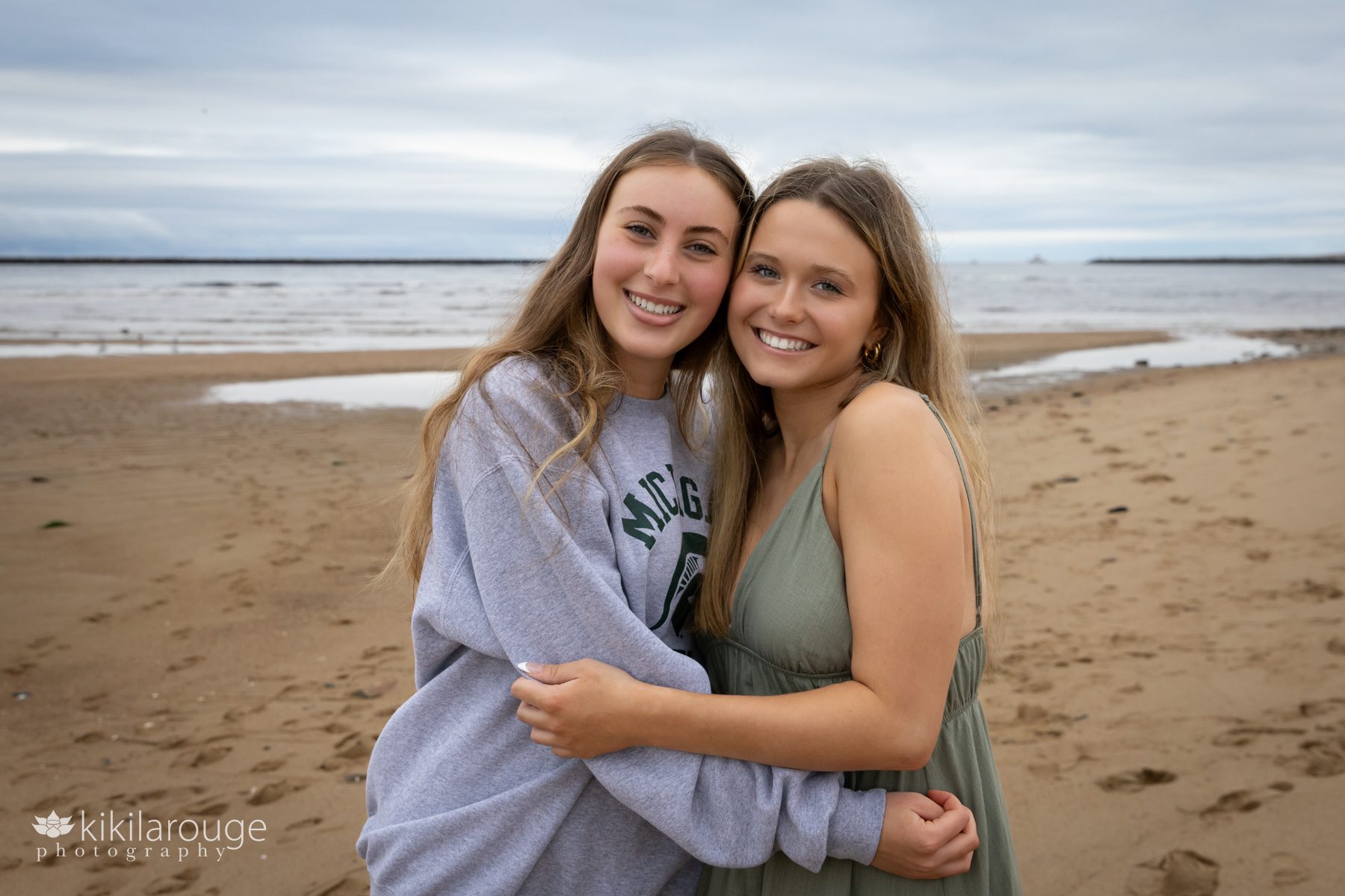Two teen girls hugging at Senior Portrait Session beach
