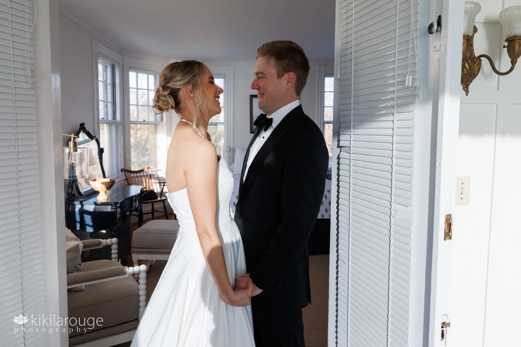 Wedding couple facing each other in bridal suite