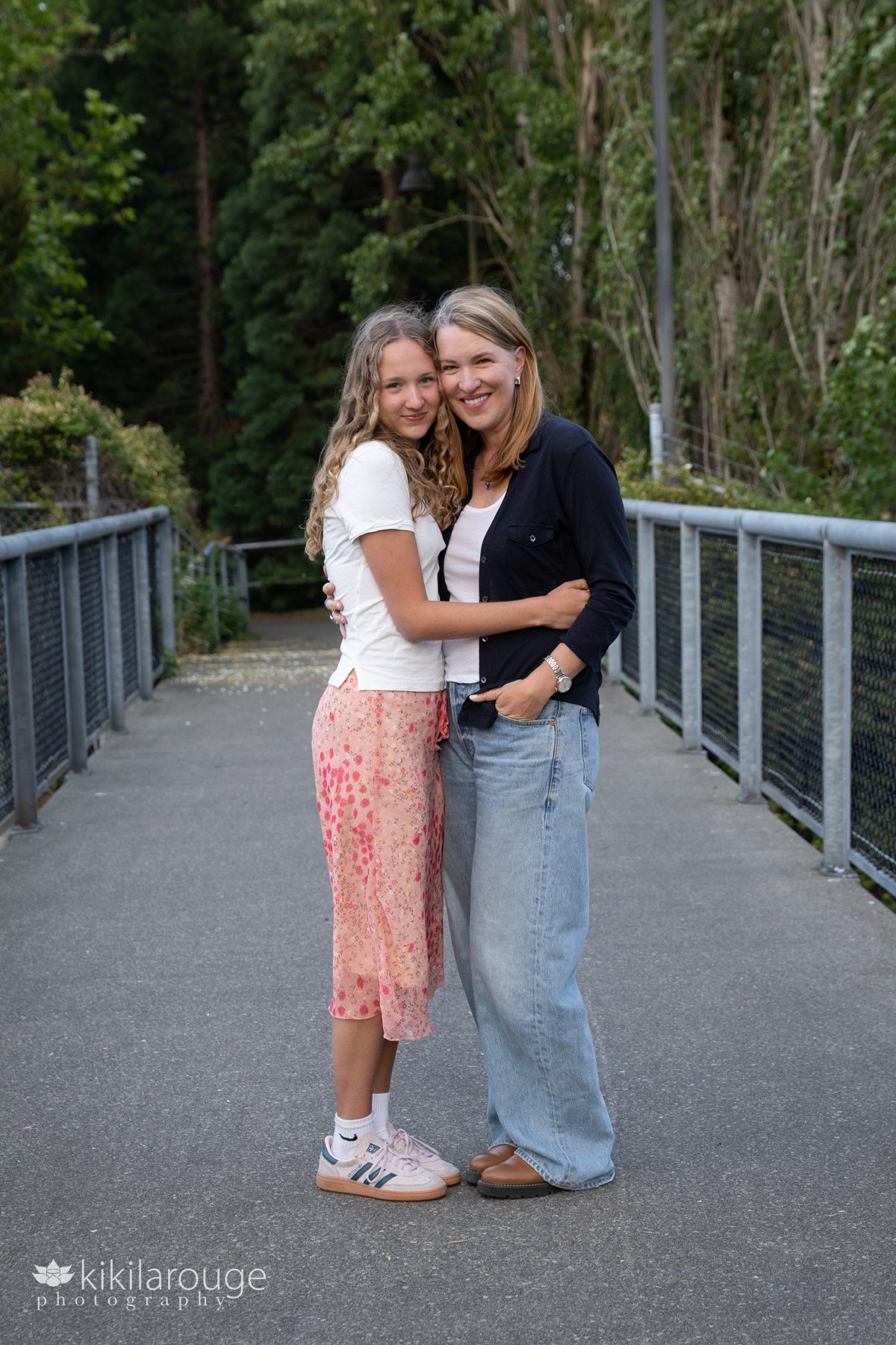 Senior girl with her Mom on metal bridge in West Seattle