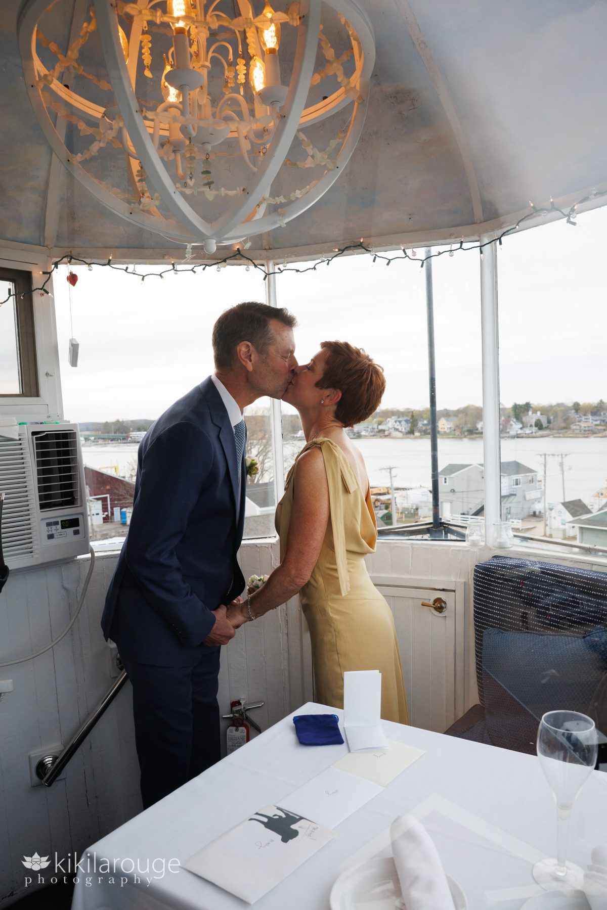 Couple kissing inside the top of the Newburyport Lighthouse after getting married.
