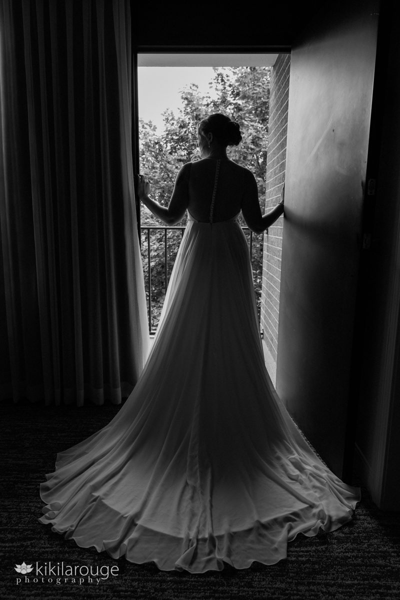 Bride in silhouette at doorway