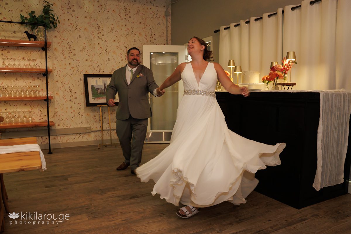 Bride and groom intro with bride's dress shining and wedding cake in backdrop