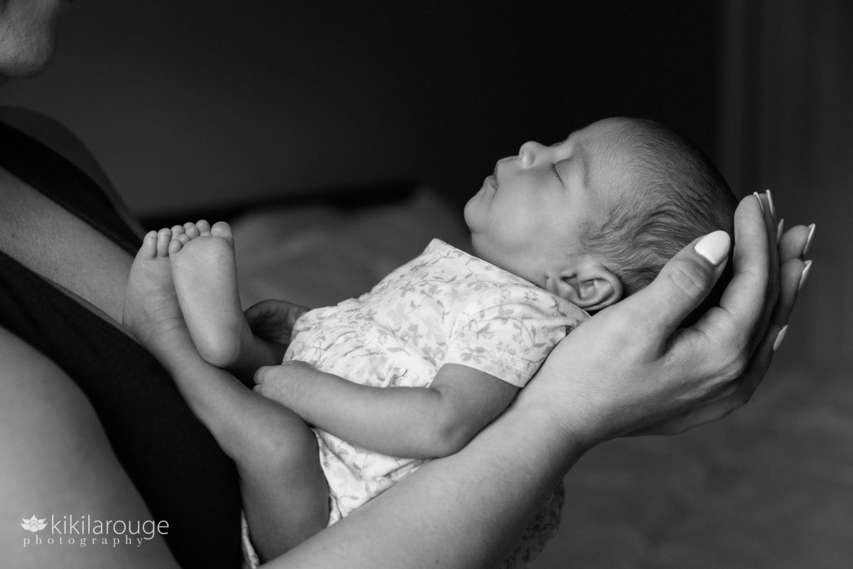 BW photo of Mom holding her newborn 