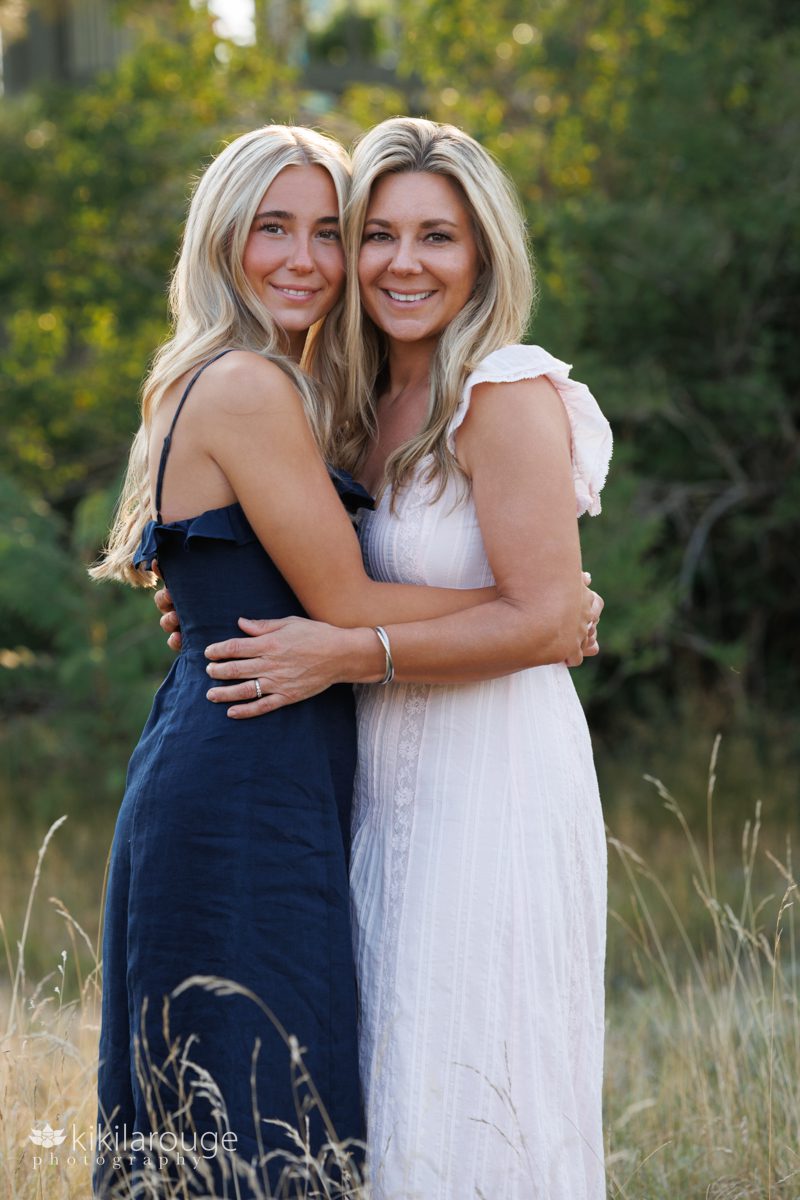 Senior girl with Mom in beach meadow